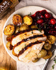 Char Crust® Roto (Rotisserie) Roast rub is used on turkey in this picture with potatoes and cranberries for a Thanksgiving meal. Char Crust Rotisserie Roast is a great turkey rub, chicken rub or steak rub.