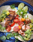 Char Crust® Jamaican Jerk dry-rub seasoning on salmon tacos. Jamaican Jerk is used as a fish rub here but is also great as a chicken rub, pork rub and beef rub.